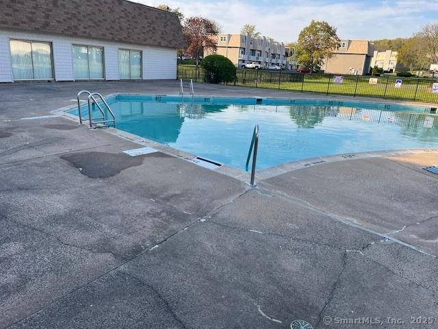 57 Meetinghouse Vlg Unit 6, Meriden, CT 06450 - community pool featuring a patio and fence