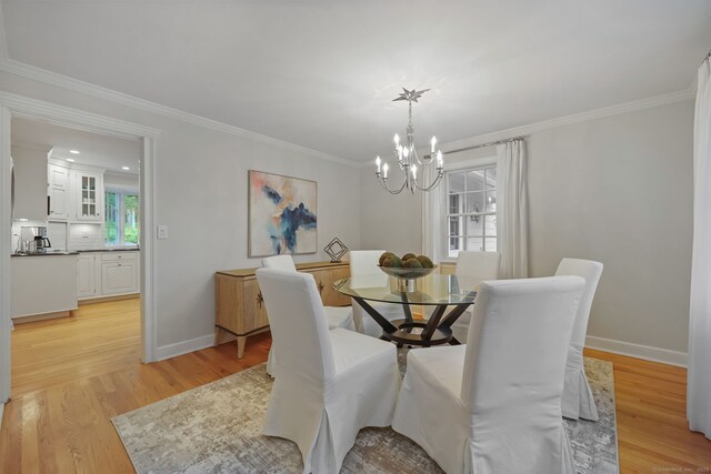 6 Weathervane Hl, Westport, CT 06880 - dining room featuring a chandelier, crown molding, light wood finished floors, and baseboards