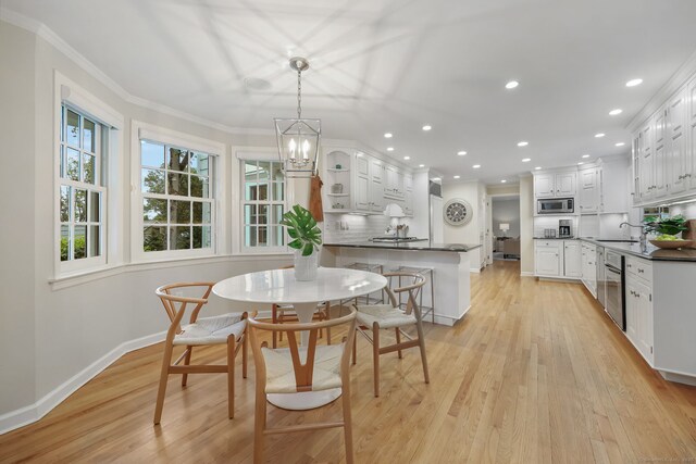 6 Weathervane Hl, Westport, CT 06880 - dining space with light wood-style floors, baseboards, ornamental molding, recessed lighting, and a chandelier