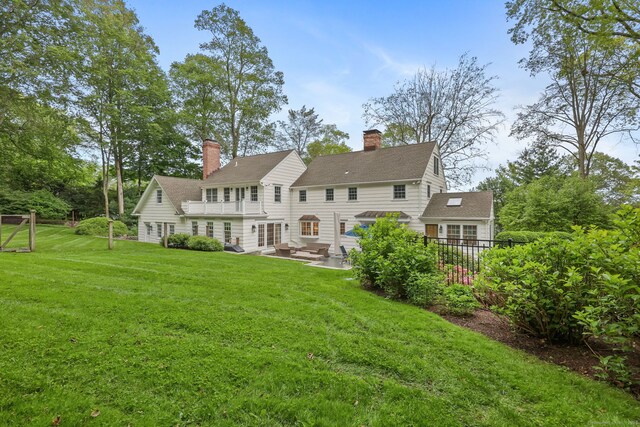 6 Weathervane Hl, Westport, CT 06880 - back of property with a patio and a chimney