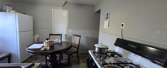 324 Mountain Grove St, Bridgeport, CT 06605 - kitchen with wainscoting and white appliances