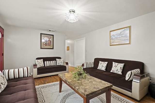 201 Orchard Ave, Newington, CT 06111 - living room featuring wood finished floors and a chandelier