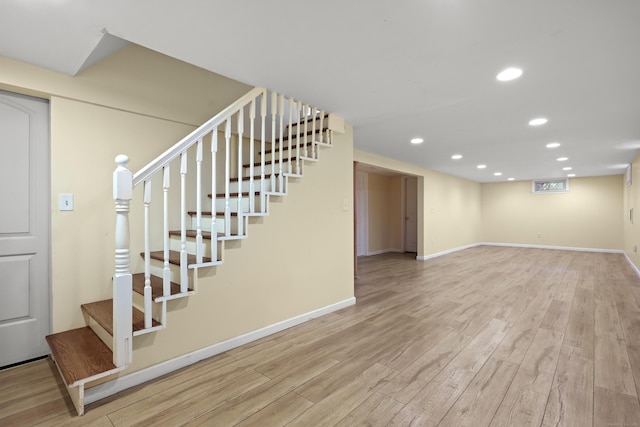 201 Orchard Ave, Newington, CT 06111 - finished basement with stairway, wood finished floors, and recessed lighting