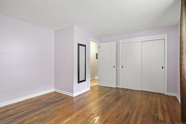 201 Orchard Ave, Newington, CT 06111 - unfurnished bedroom featuring wood finished floors and a closet
