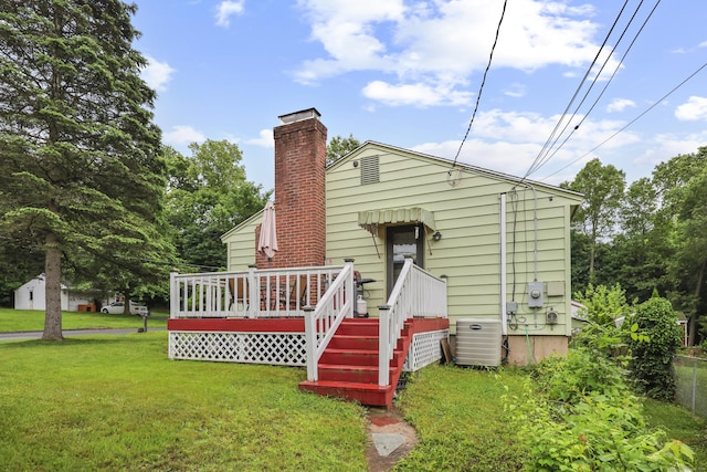 201 Orchard Ave, Newington, CT 06111 - rear view of house featuring a yard, a deck, and a chimney