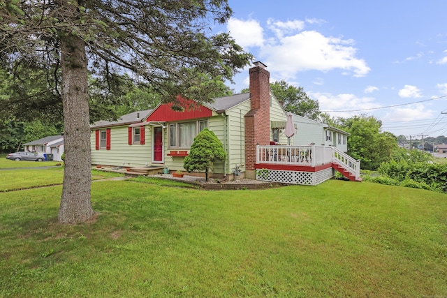 201 Orchard Ave, Newington, CT 06111 - view of front of property featuring a chimney, a front yard, and a wooden deck