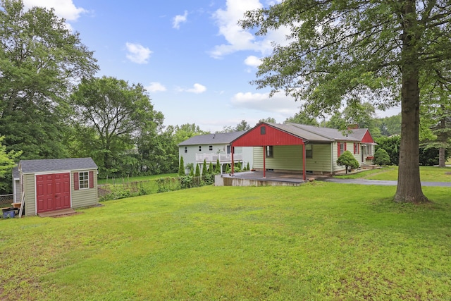 201 Orchard Ave, Newington, CT 06111 - view of grassy yard featuring a storage unit and a wooden deck