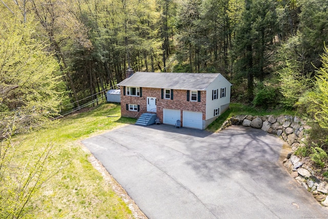 drone / aerial view with a wooded view