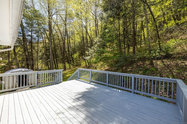 deck featuring a wooded view
