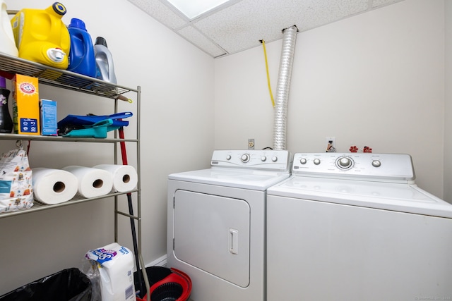 washroom with separate washer and dryer and laundry area