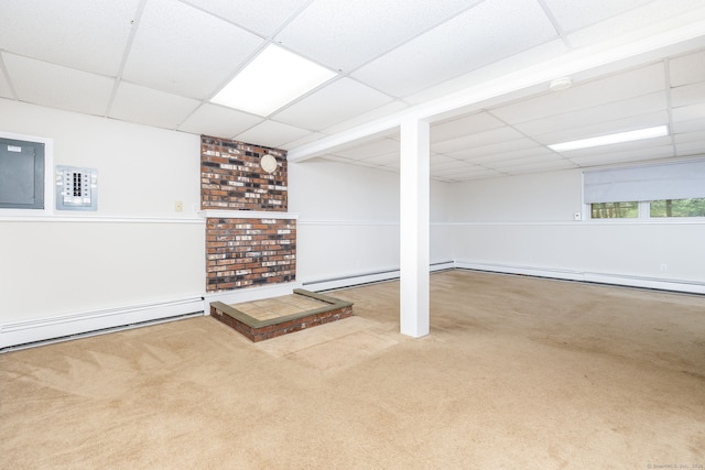 basement featuring carpet flooring, a drop ceiling, and baseboard heating