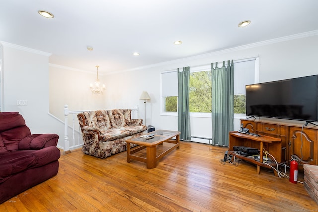 living room featuring ornamental molding, recessed lighting, wood finished floors, and a notable chandelier