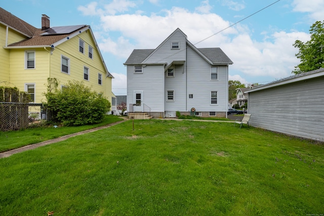 19 Terhune Ave, Branford, CT 06405 - back of property with a yard and fence