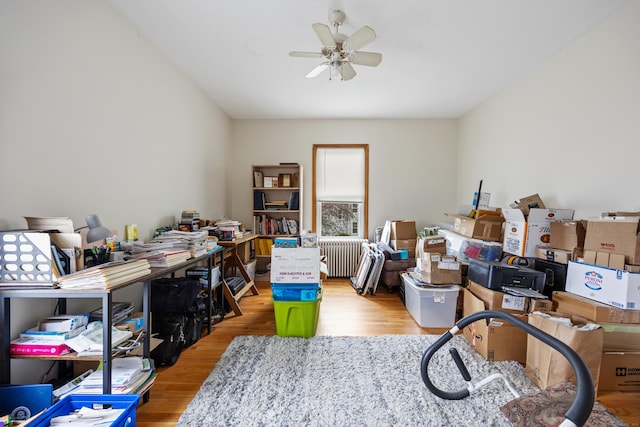 19 Terhune Ave, Branford, CT 06405 - interior space featuring wood finished floors, ceiling fan, and radiator heating unit