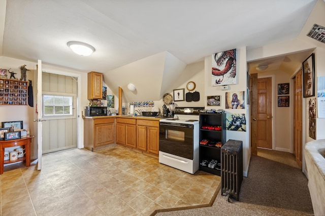19 Terhune Ave, Branford, CT 06405 - kitchen with radiator, range with electric stovetop, visible vents, vaulted ceiling, and black microwave