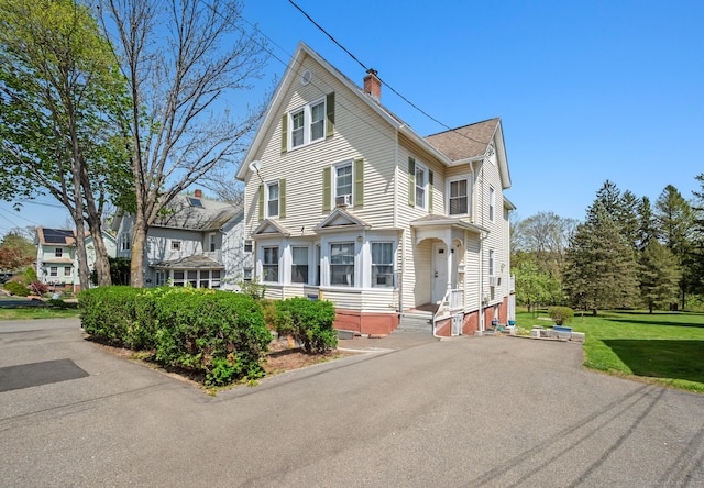 116 Front St, Middletown, CT 06457 - view of front facade with a chimney and a front yard