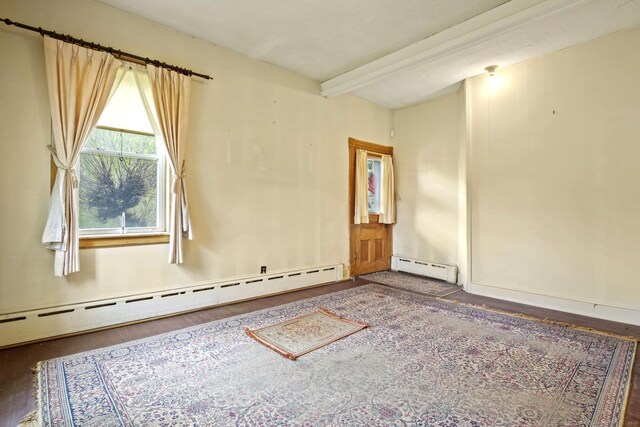 298 Wall St, Waterbury, CT 06704 - unfurnished room featuring a baseboard radiator, wood finished floors, and beam ceiling