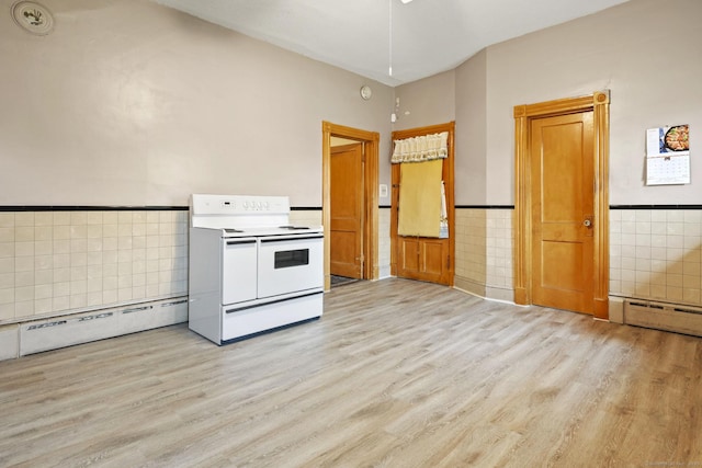 298 Wall St, Waterbury, CT 06704 - kitchen featuring double oven range, baseboard heating, tile walls, light wood finished floors, and a wainscoted wall