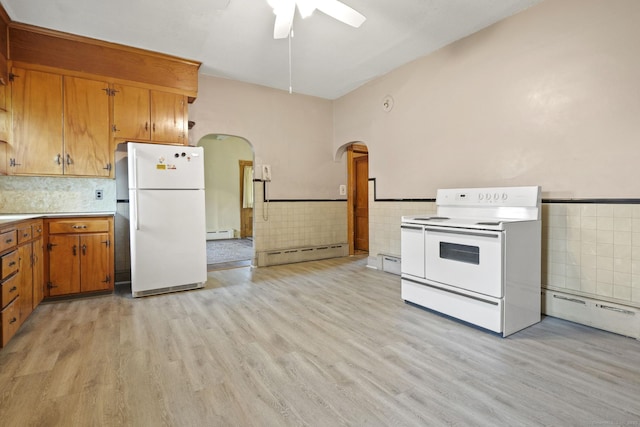 298 Wall St, Waterbury, CT 06704 - kitchen featuring white appliances, tile walls, a baseboard radiator, a baseboard heating unit, and arched walkways