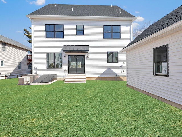 13 Dunbar Rd, Milford, CT 06460 - back of house featuring central AC unit, a yard, and entry steps
