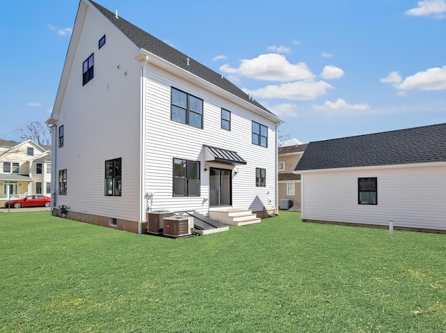 13 Dunbar Rd, Milford, CT 06460 - rear view of house with a lawn and central air condition unit