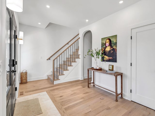 13 Dunbar Rd, Milford, CT 06460 - entryway with recessed lighting, baseboards, stairway, and light wood finished floors