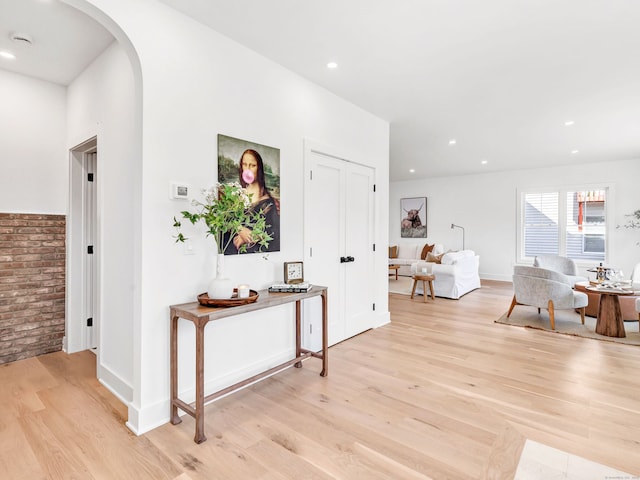 13 Dunbar Rd, Milford, CT 06460 - corridor featuring recessed lighting, arched walkways, and light wood finished floors