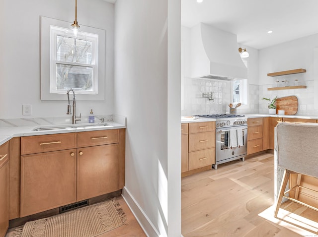 13 Dunbar Rd, Milford, CT 06460 - kitchen featuring open shelves, a sink, high end range, custom range hood, and tasteful backsplash