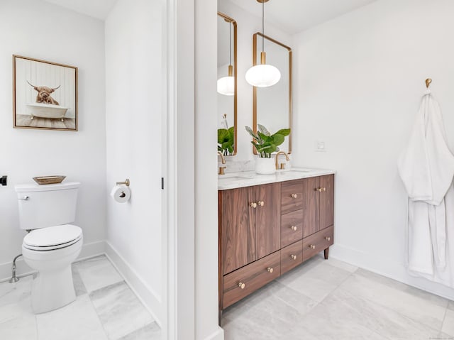 13 Dunbar Rd, Milford, CT 06460 - bathroom featuring a sink, baseboards, and toilet