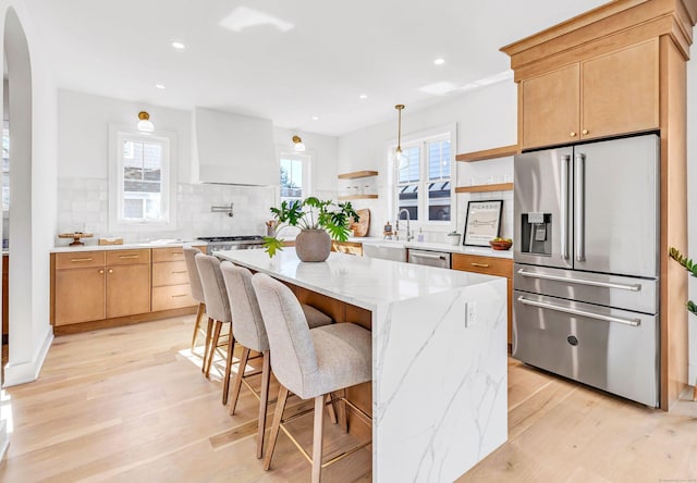 13 Dunbar Rd, Milford, CT 06460 - kitchen featuring open shelves, appliances with stainless steel finishes, custom exhaust hood, and light wood-style floors