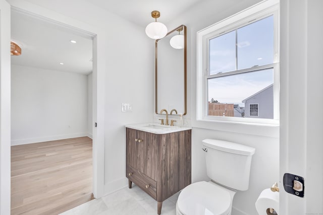 13 Dunbar Rd, Milford, CT 06460 - bathroom featuring vanity, toilet, recessed lighting, baseboards, and wood finished floors