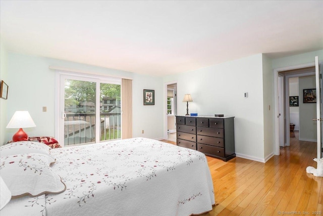 28D Harbour Vlg, Branford, CT 06405 - bedroom featuring access to outside, light wood-style floors, and baseboards