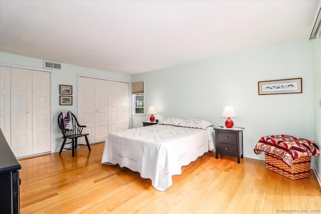 28D Harbour Vlg, Branford, CT 06405 - bedroom with light wood-style floors and multiple closets