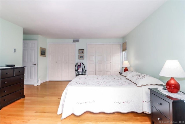 28D Harbour Vlg, Branford, CT 06405 - bedroom with multiple closets and light wood-style floors