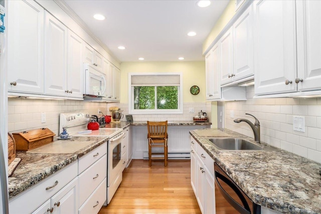 28D Harbour Vlg, Branford, CT 06405 - kitchen featuring white appliances, a sink, a baseboard radiator, tasteful backsplash, and recessed lighting