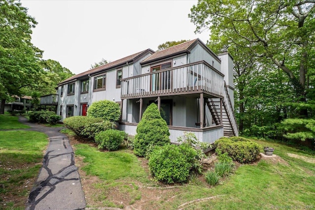 28D Harbour Vlg, Branford, CT 06405 - view of front of home featuring stairway, a wooden deck, and a front lawn