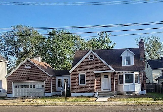 view of front of property with brick siding, a garage, fence, and a chimney