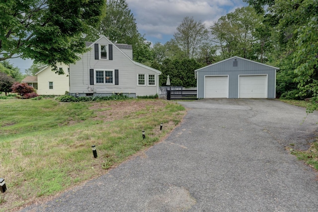140 College Ave, Torrington, CT 06790 - view of front of house with a detached garage and an outbuilding