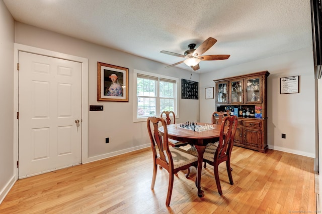 140 College Ave, Torrington, CT 06790 - dining room with light wood-style floors, ceiling fan, baseboards, and a textured ceiling