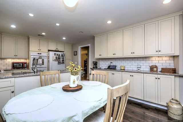 24 Wall St, Shelton, CT 06484 - dining area featuring dark wood-style flooring and recessed lighting