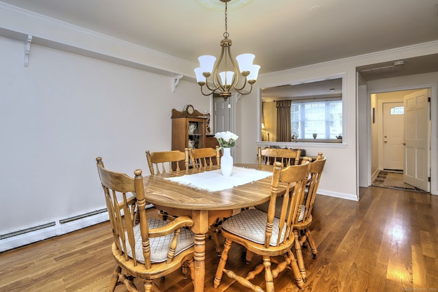 24 Wall St, Shelton, CT 06484 - dining area featuring a chandelier, wood finished floors, ornamental molding, a baseboard heating unit, and baseboards