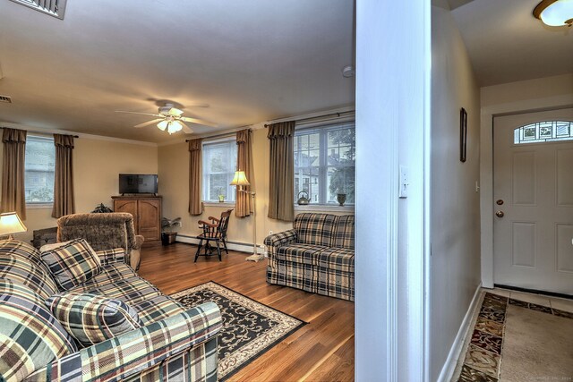 24 Wall St, Shelton, CT 06484 - living area featuring baseboard heating, baseboards, ceiling fan, and healthy amount of natural light