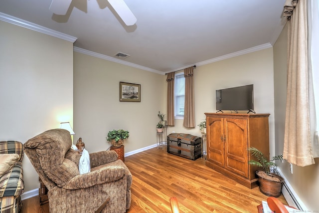 24 Wall St, Shelton, CT 06484 - living room with crown molding, a ceiling fan, light wood-style floors, baseboards, and a baseboard radiator