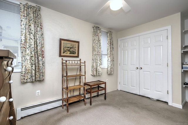 24 Wall St, Shelton, CT 06484 - living area featuring a baseboard radiator, carpet floors, a ceiling fan, and plenty of natural light