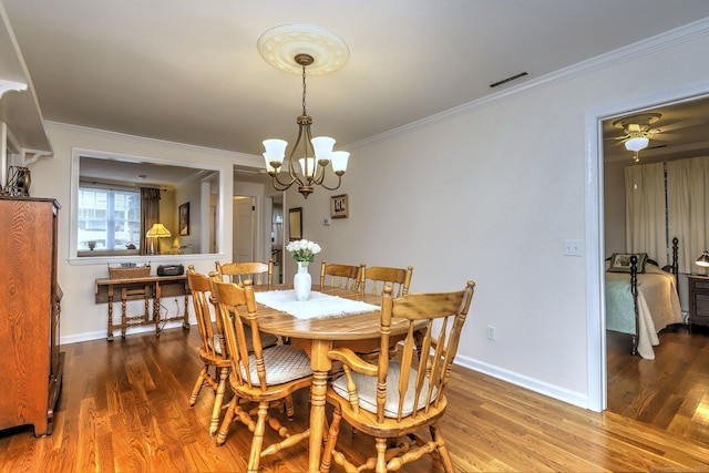 24 Wall St, Shelton, CT 06484 - dining room featuring a chandelier, wood finished floors, ornamental molding, and baseboards
