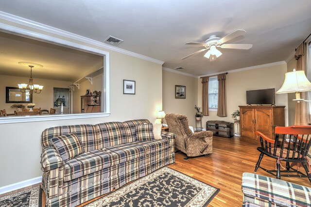 24 Wall St, Shelton, CT 06484 - living room featuring a chandelier, wood finished floors, a ceiling fan, crown molding, and baseboards