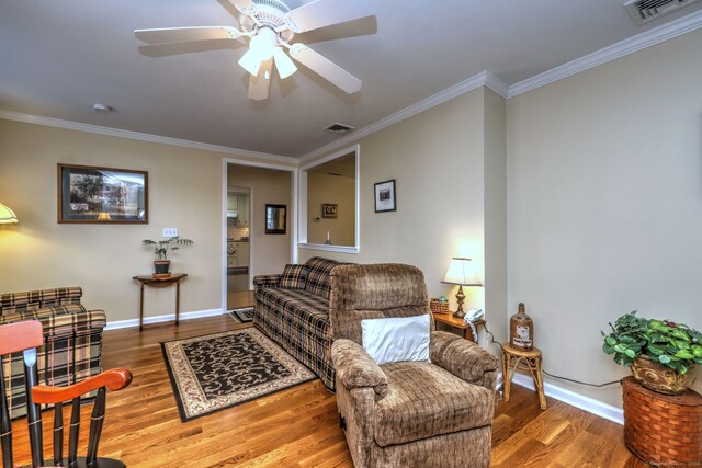 24 Wall St, Shelton, CT 06484 - living room featuring wood finished floors, ornamental molding, a ceiling fan, and baseboards