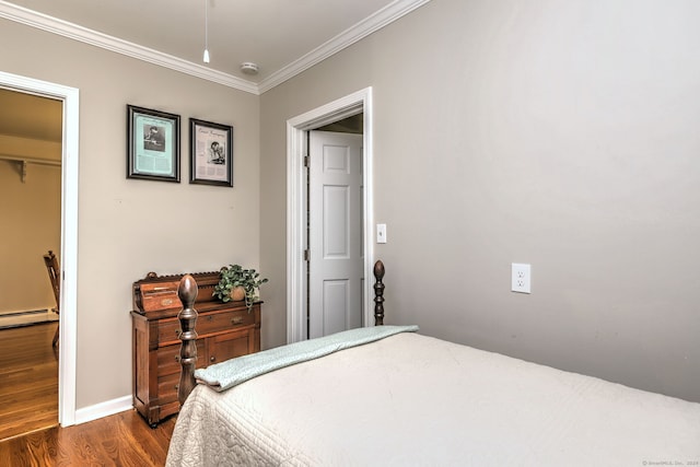 24 Wall St, Shelton, CT 06484 - bedroom featuring dark wood finished floors, ornamental molding, a baseboard radiator, and baseboards