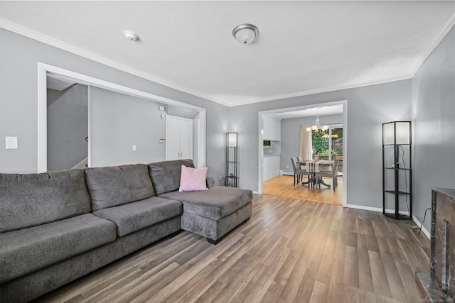 333 Vincellette St Unit 25, Bridgeport, CT 06606 - living room with wood finished floors, a chandelier, crown molding, and baseboards