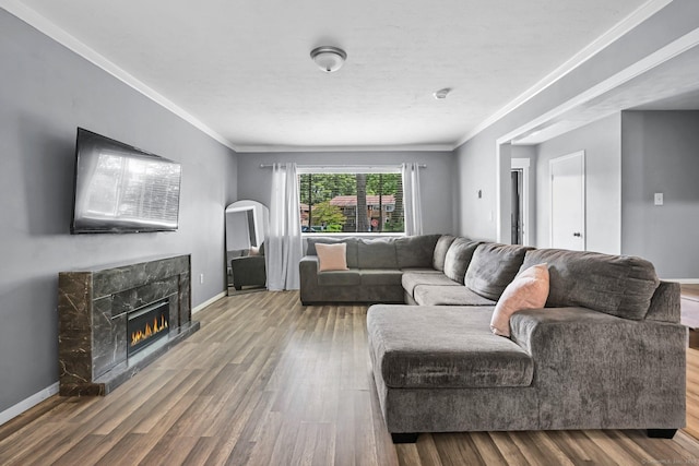 333 Vincellette St Unit 25, Bridgeport, CT 06606 - living area with a glass covered fireplace, wood finished floors, baseboards, and crown molding